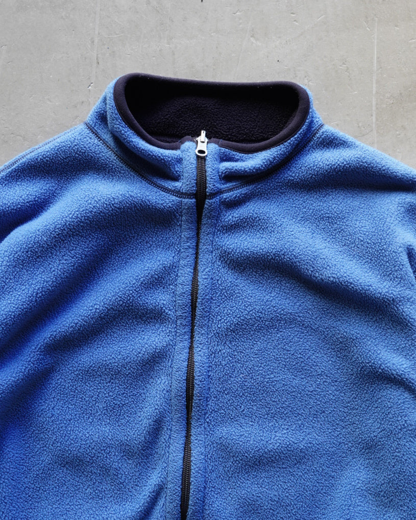 light blue and navy reversible fleece zip-up jacket